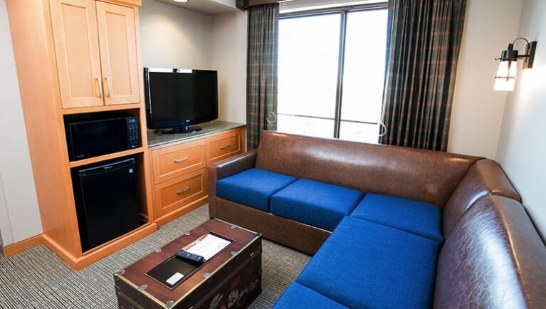 The living space and couch in the Junior Grizzly Family Suite